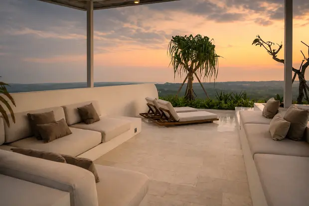 Deep outdoor sofas and daybeds on the terrace at Villa Kalani at sunset